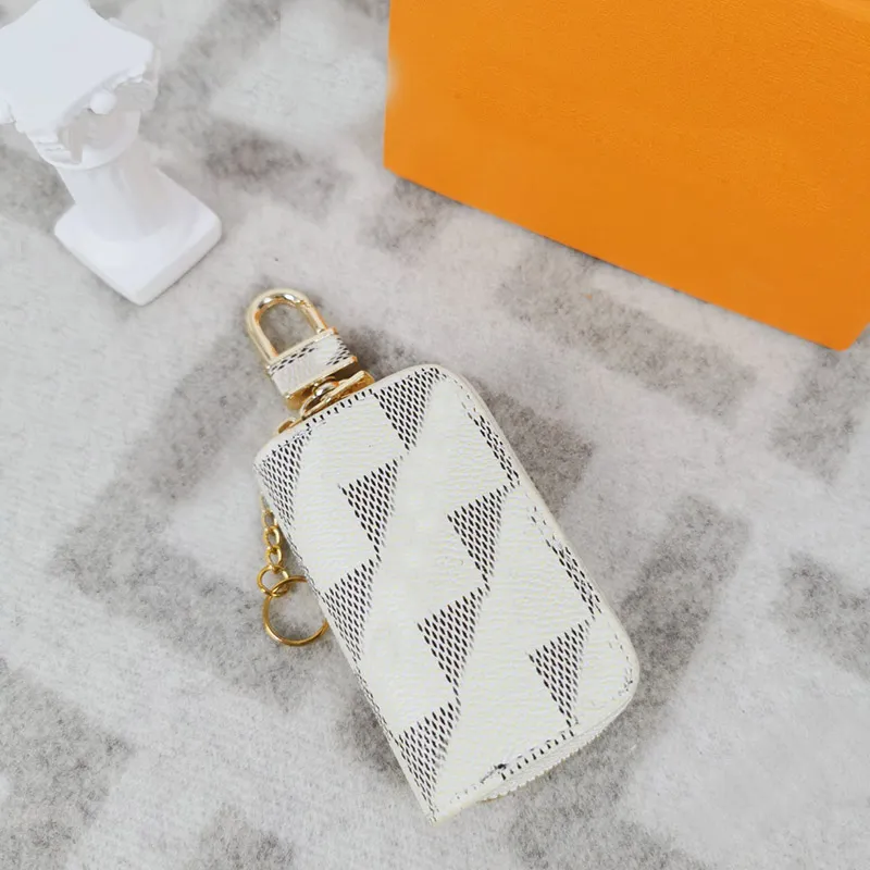 Diseñador de moda Pu Llaveros Llavero Hombres Mujeres Bolsas Colgante Hebilla Llavero Coche Colgante de cuero hecho a mano Llave