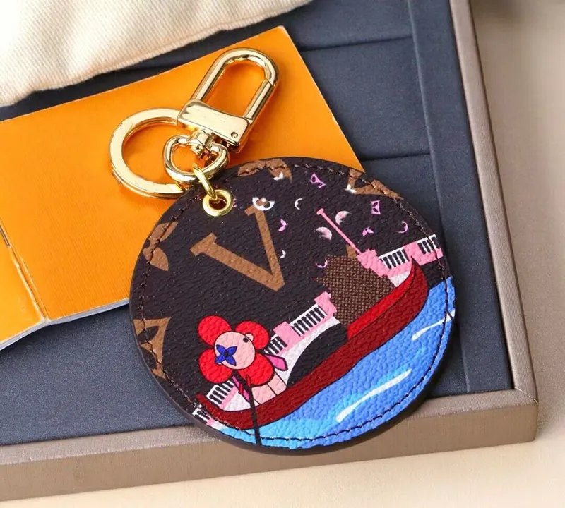 Luxurys Designer Llavero Marca Redonda Llavero Hombres Coche Llavero Mujeres Hebilla Llaveros Bolsa Colgante Exquisito Regalo Ll