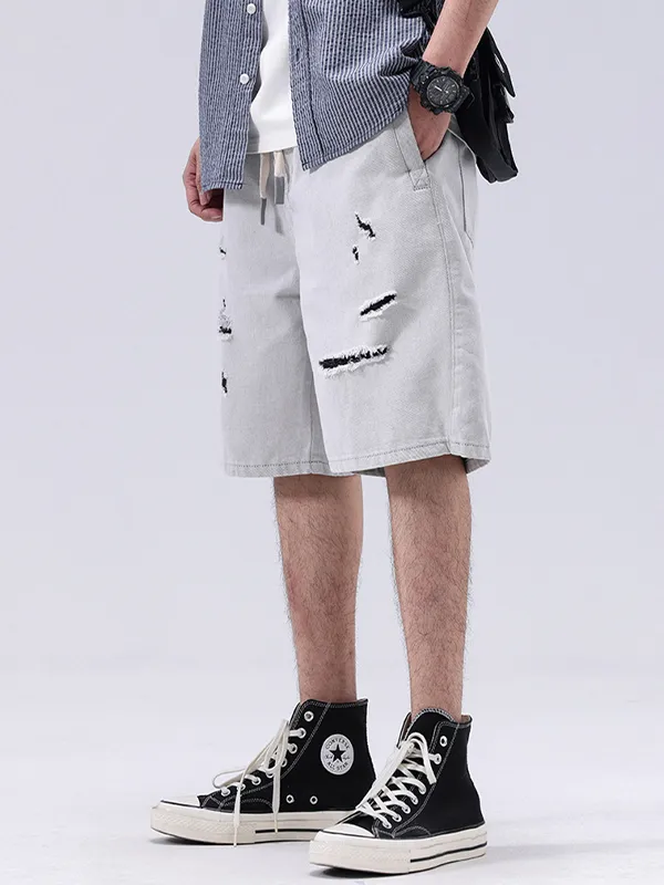 Pantalones cortos rectos sueltos rasgados de color en contraste para hombre