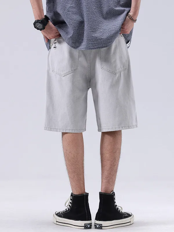 Pantalones cortos rectos sueltos rasgados de color en contraste para hombre